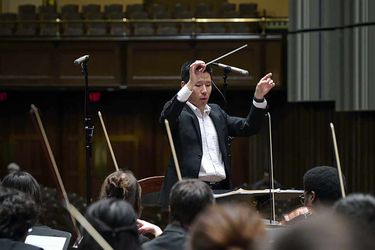 David Zhang conducting the Penn Orchestra.