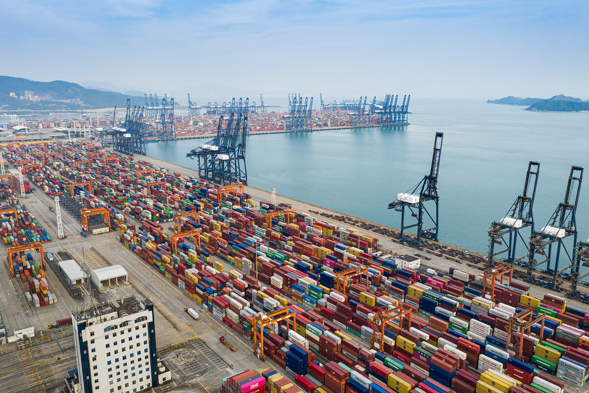 Shipping containers lined up outside a port in China.