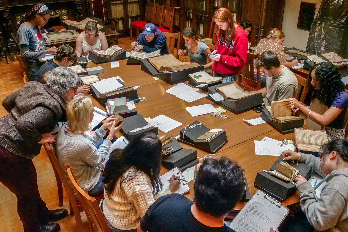 Elly Truitt and students looking at manuscripts in the Kislak Center.